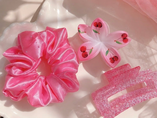 Close-up of cherry hair set – pink scrunchie, cherry butterfly clip and pink claw clip – Lande Accessories